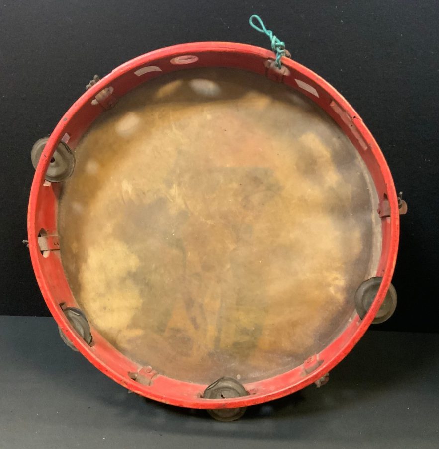 An early 20th century Italian tambourine, painted with a portrait of a gentleman, 33cm diam, probably Neapolitan, c.1910