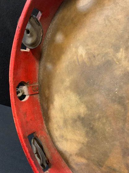 An early 20th century Italian tambourine, painted with a portrait of a gentleman, 33cm diam, probably Neapolitan, c.1910